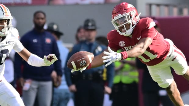 Razorbacks Jaylon Braxton dives for a pass against Auburn
